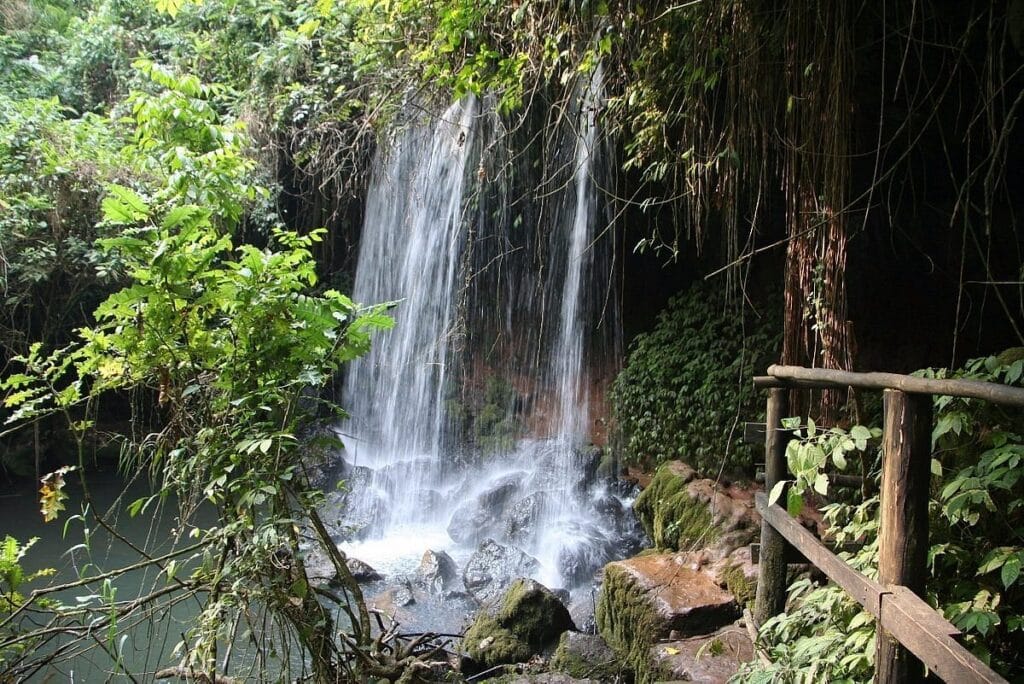 Guided tour of the historic Amabere Caves with a local elder near Ruboni Village