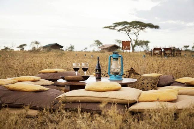 hampagne sundowner overlooking the Nile during a private luxury safari in Uganda