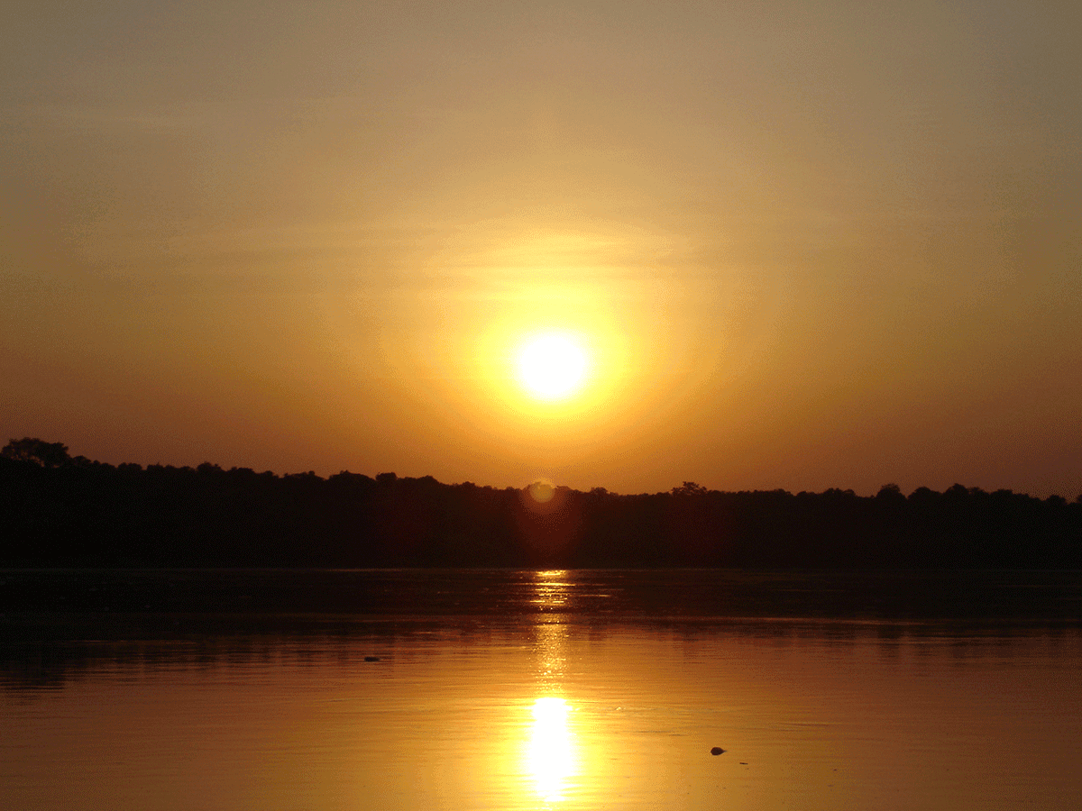 Adventurer hiking to the top of Murchison Falls, overlooking the Nile on a safari in Uganda Murchison Falls.