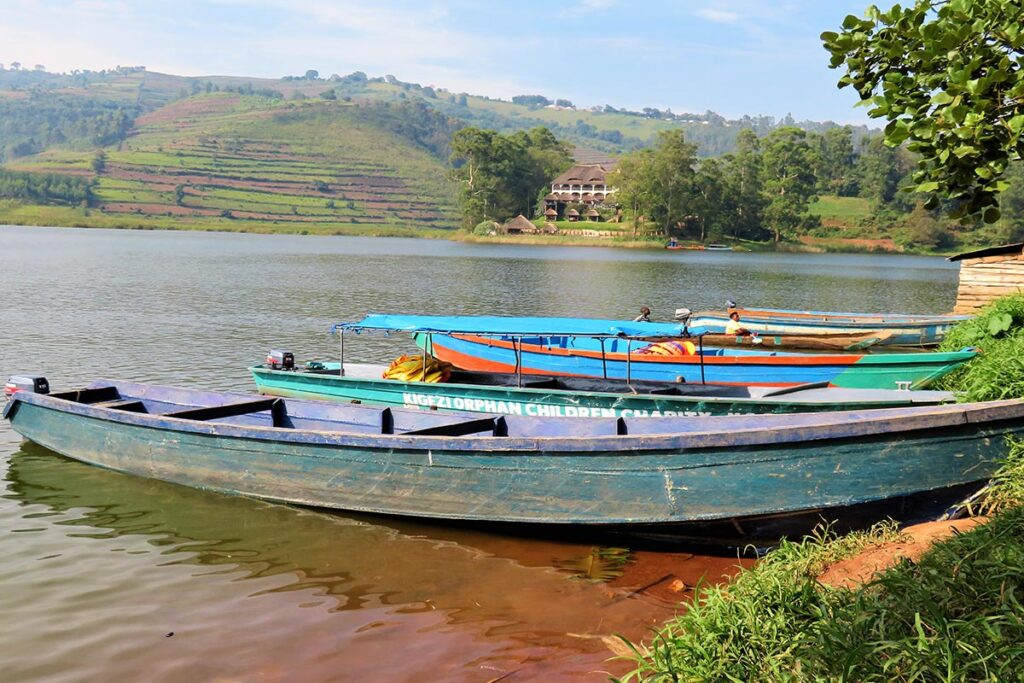 A couple on a private boat ride on Lake Bunyonyi on a 7 day luxury honeymoon safari Uganda with private plunge pool lodges