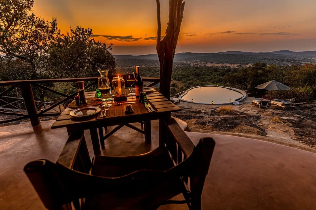A romantic candlelit dinner for two on a 7 day luxury honeymoon safari Uganda with private plunge pool lodges