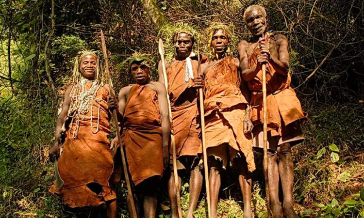 Travelers participating in a Batwa community visit during their 4 day Bwindi gorilla habituation experience itinerary and cost adventure