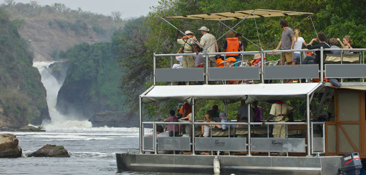 A boat cruise on the Nile River on a 4 day Murchison Falls boat cruise and chimpanzee tracking Budongo Forest safari