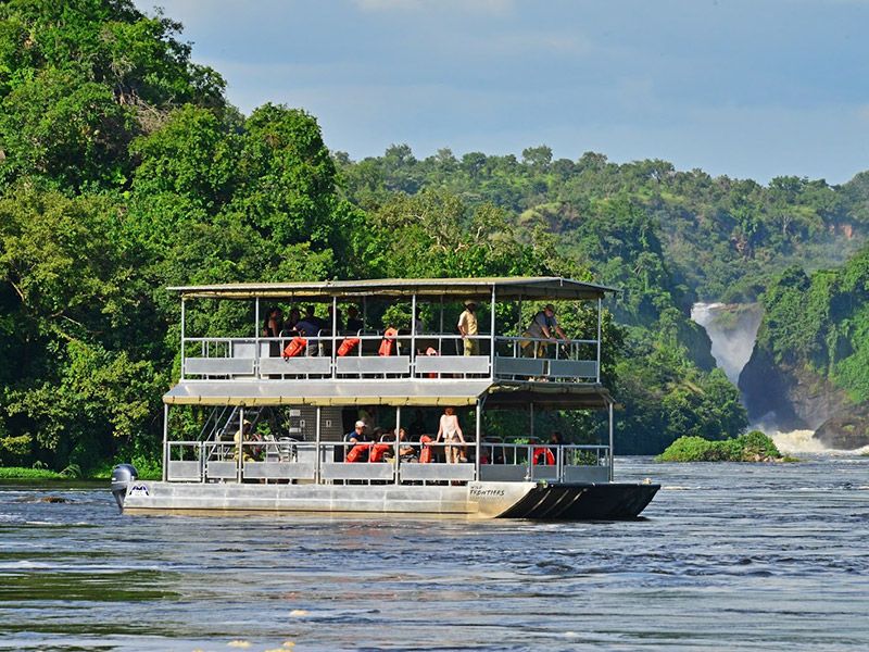 A boat cruise approaching the base of Murchison Falls on a Murchison Falls National Park safari