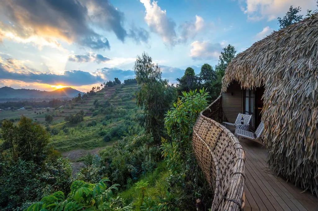A traveler engaging with a local community on a 7 day eco-friendly sustainable safari package in Uganda