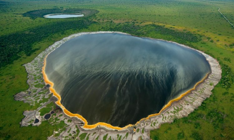 A stunning crater lake in Queen Elizabeth National Park, explored on a safari