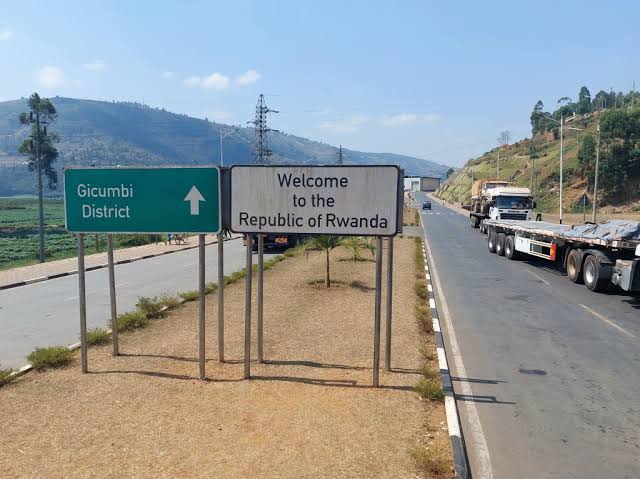 Travelers crossing the Cyanika border during a 2 day fast track gorilla trekking tour from Kigali Rwanda to Mgahinga