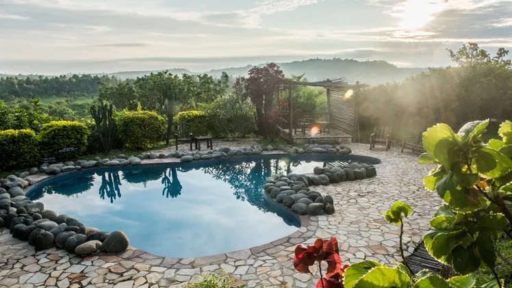 Infinity pool at Clouds Mountain Gorilla Lodge with volcano views, part of a 5 day luxury fly-in gorilla safari staying at Clouds Mountain Gorilla Lodge