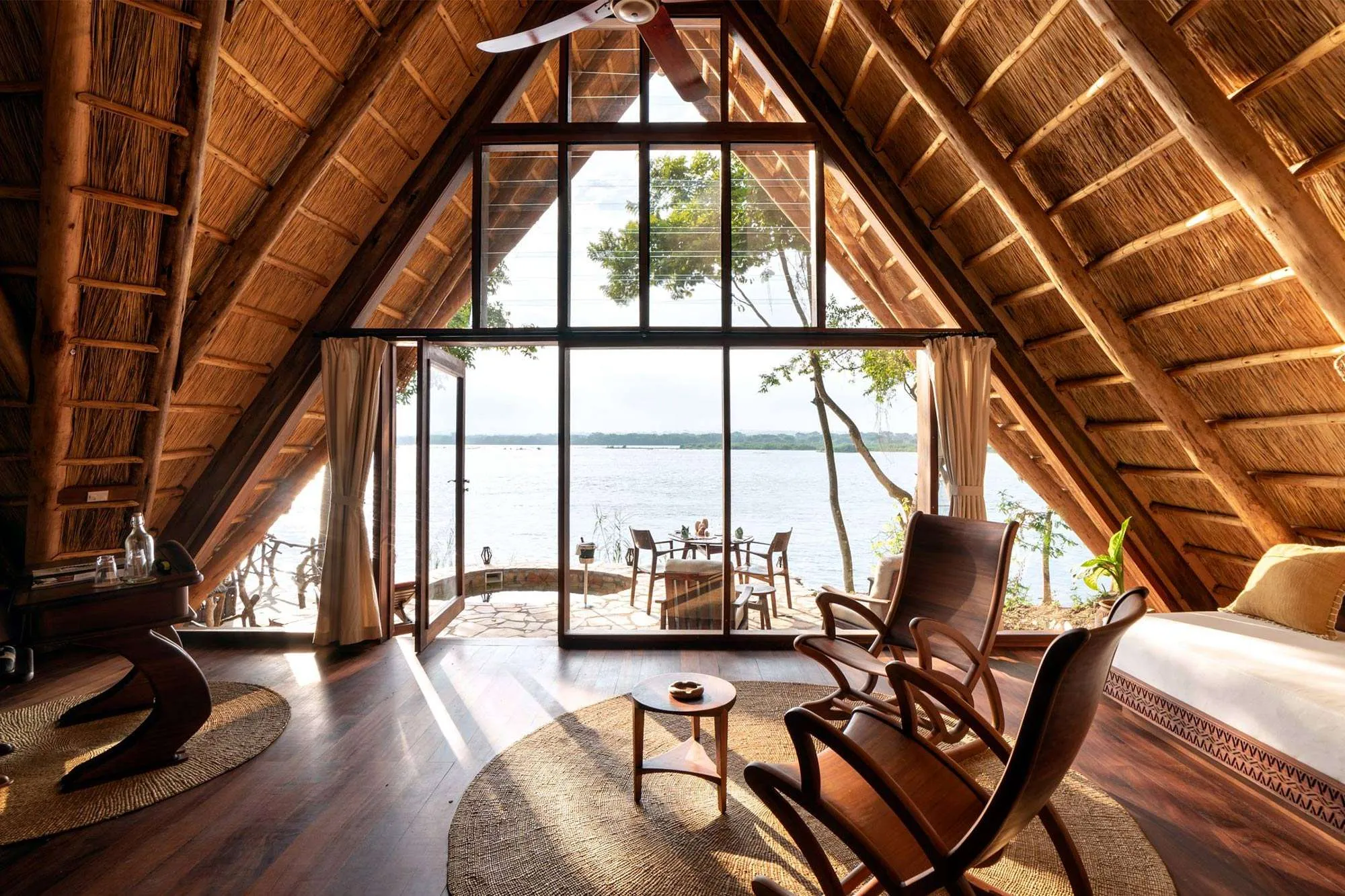 Comparison of inside vs outside national park lodges Uganda, showing the differences in location and experience