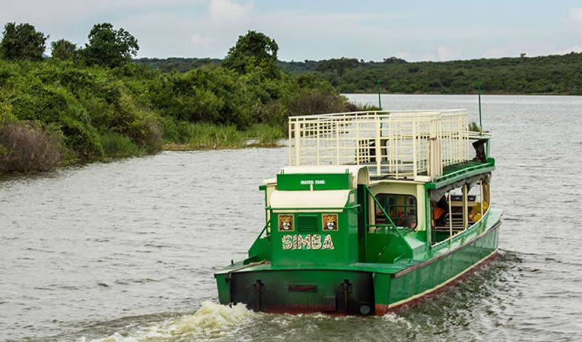 A boat safari on Kazinga Channel with hippos on a 5 day budget Big Five safari Uganda starting in Kampala