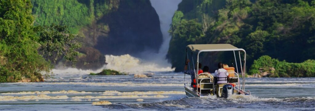 A private boat cruise with champagne approaching Murchison Falls on a 3 day luxury safari staying at Paraa Safari Lodge