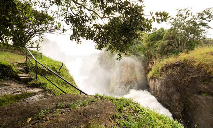Hikers at the top of Murchison Falls, enjoying panoramic views on a Murchison Falls National Park safari
