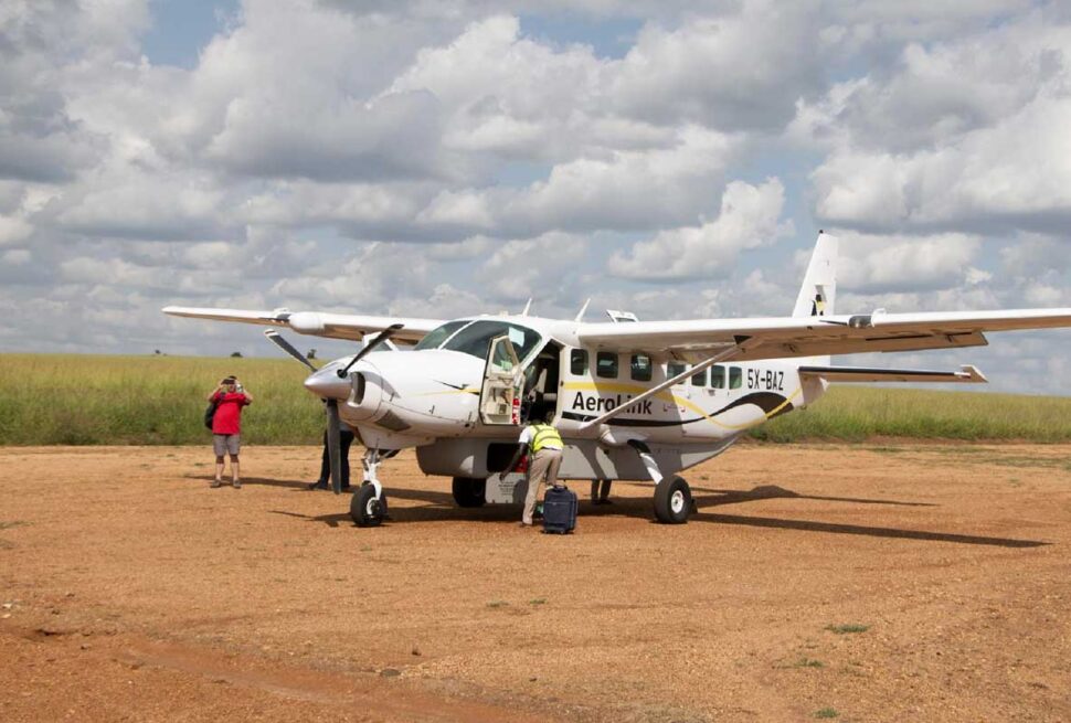 Aerolink flights Uganda vs driving safari parks – Aerolink plane at a Uganda airstrip