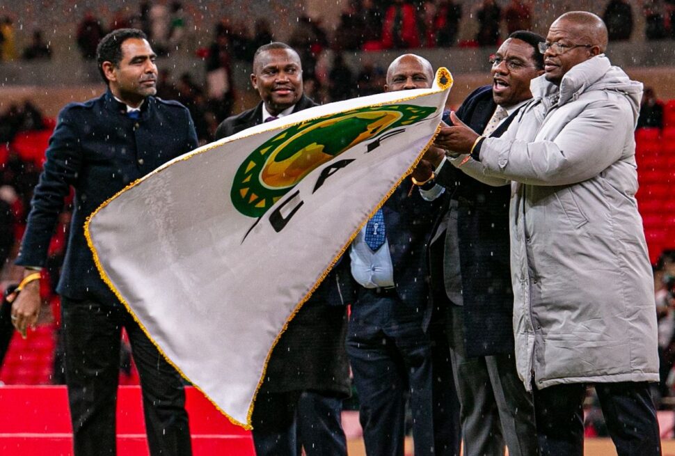 AFCON 2026 Matchday Weather Predictor – football fans in Kampala with jackets and scarves