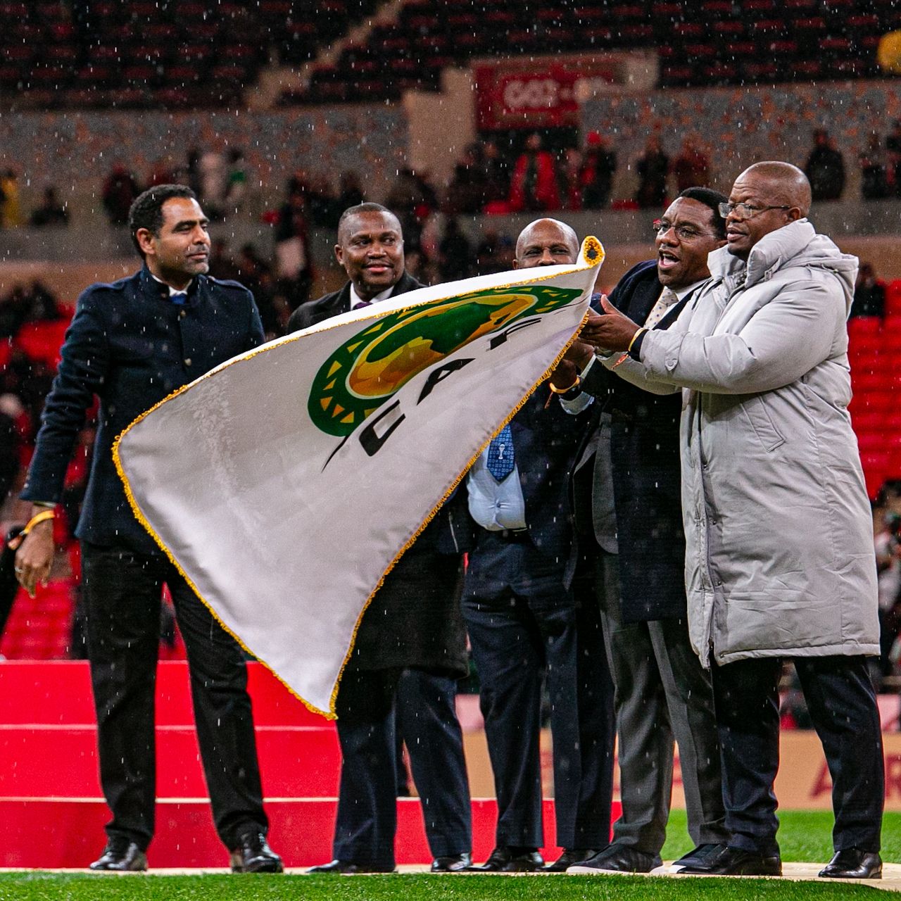 AFCON 2026 Matchday Weather Predictor – football fans in Kampala with jackets and scarves