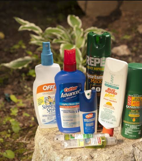 Best DEET repellent Uganda jungle trekking – applying insect repellent before jungle trekking