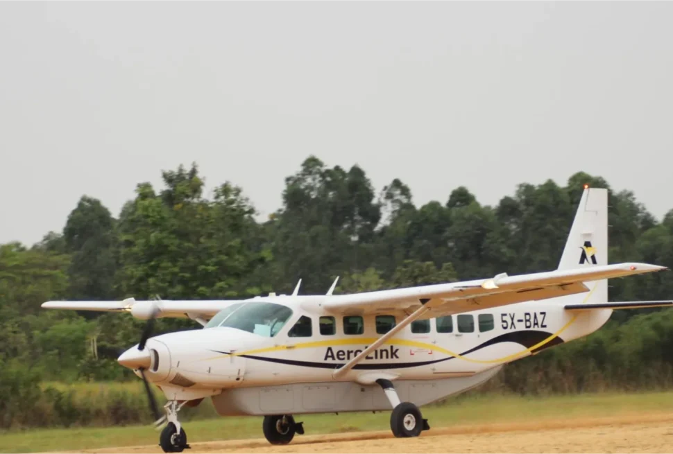 Cheapest domestic charter flights to Kisoro vs road drive - Aerolink aircraft landing at Kisoro airstrip