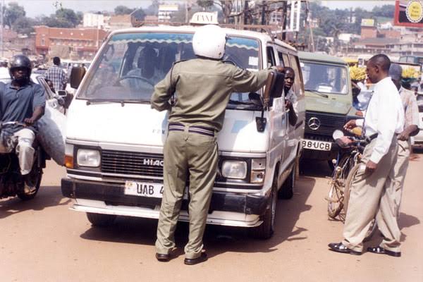 Driving in Uganda police bribe traffic stop – police checkpoint on a Ugandan highway