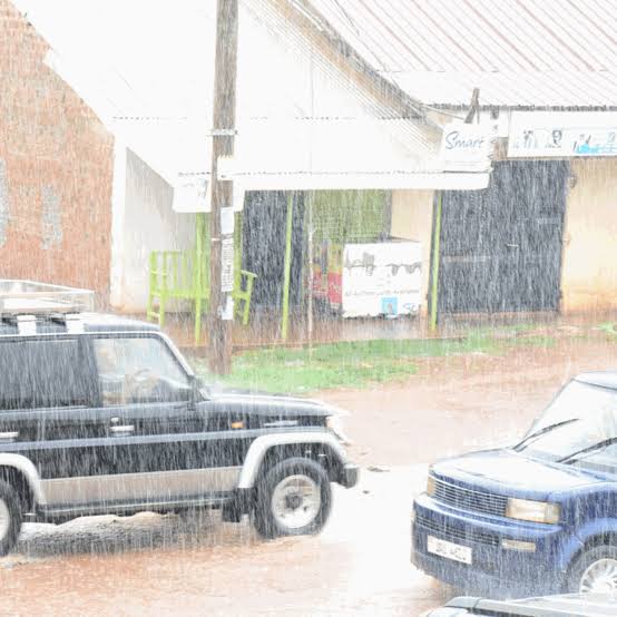 Driving Uganda rainy season safari tracks – rain falling on a safari vehicle in Uganda