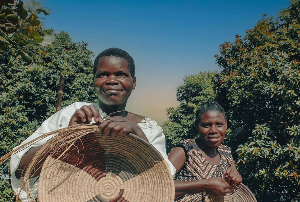 Ethics of photographing children village tours Uganda – traveler asking permission before photographing