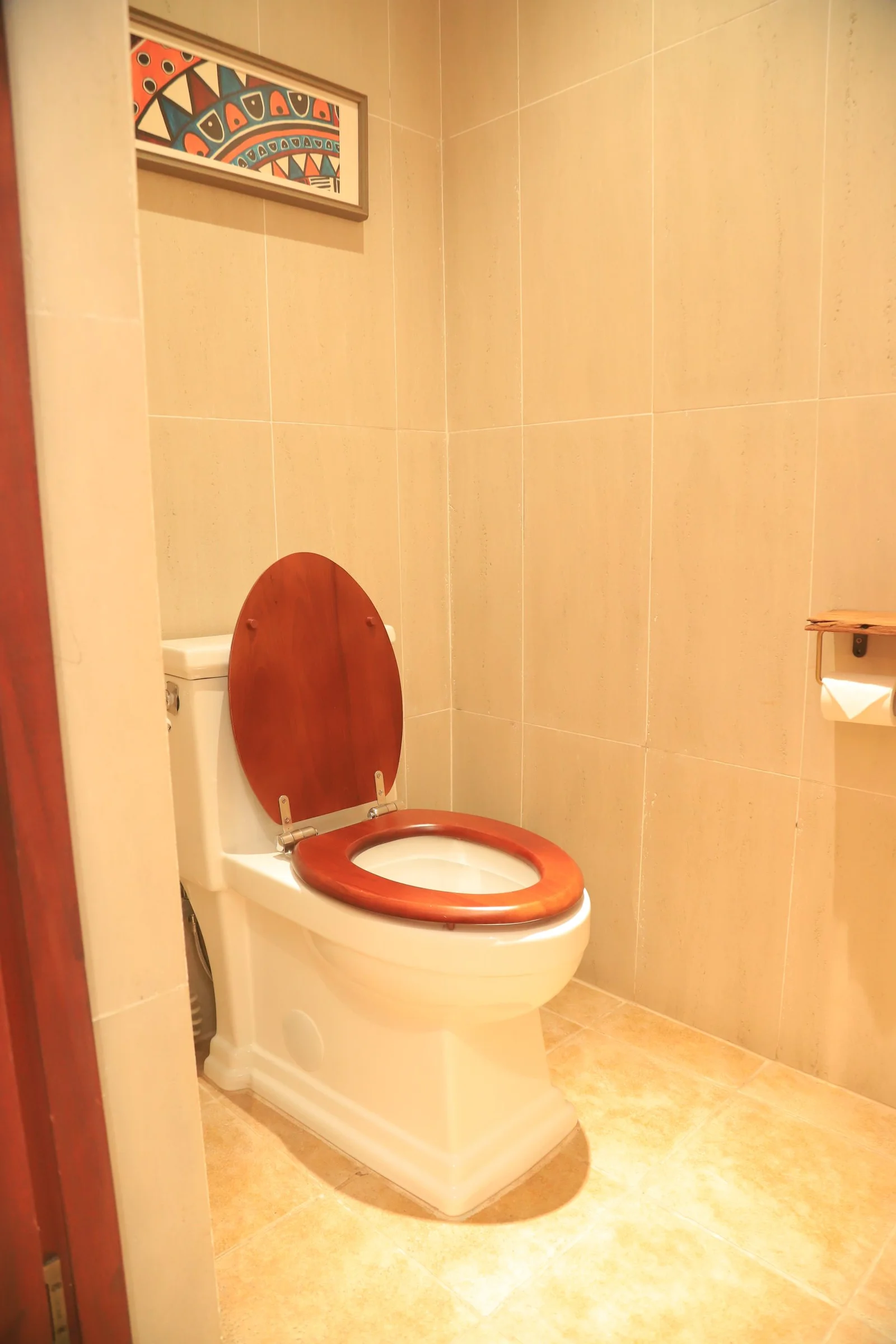 Hot water flush toilet facilities Uganda safari camps – modern flush toilet at a Uganda safari camp
