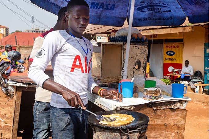 Is eating rolex street food safe Uganda – busy street food stall in Uganda
