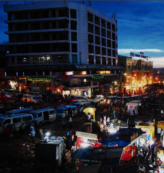 Kampala nightlife safety for tourists – Kampala city street lit up at night with people