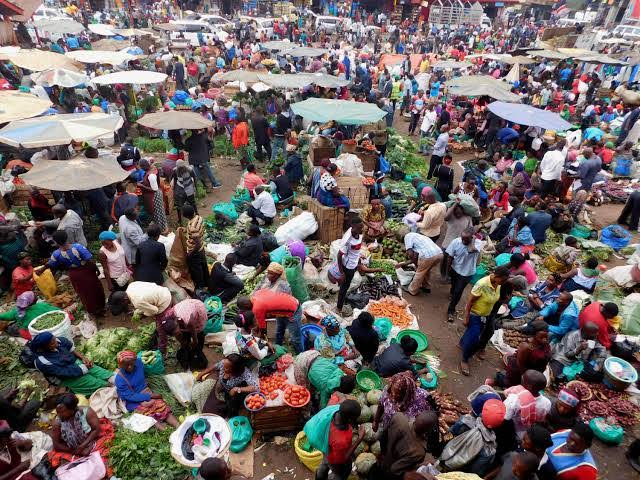 Kampala rest day activities AFCON 2026 – Owino Market shoppers and colorful fabrics in Kampala