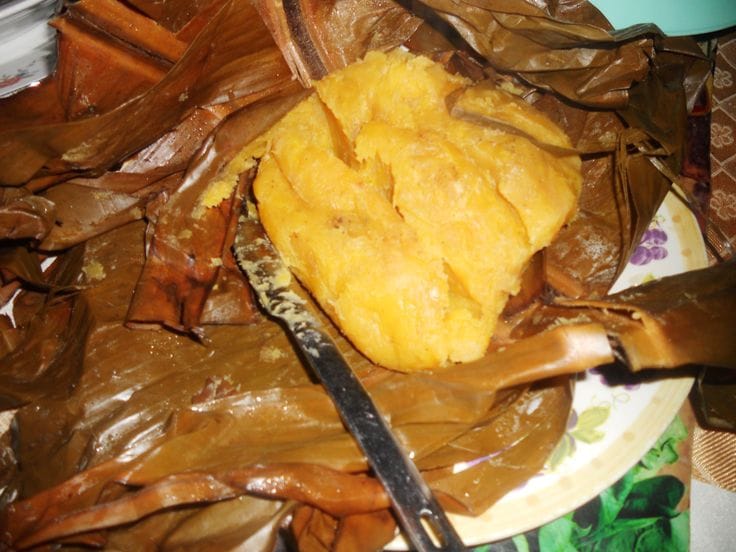 Matooke cooking Uganda – steaming green bananas