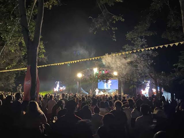Night view of the campsite at Nyege Nyege Festival 2026 with tents and festival lights