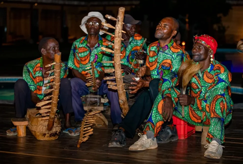 Tipping traditional dancers safari lodge performance – traditional dancers at a Uganda safari lodge