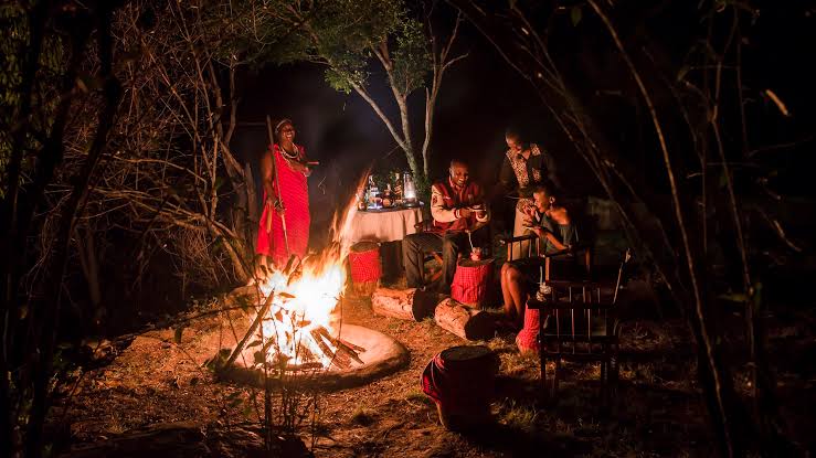 Tipping traditional dancers safari lodge performance – dance performance around a fire at a safari lodge
