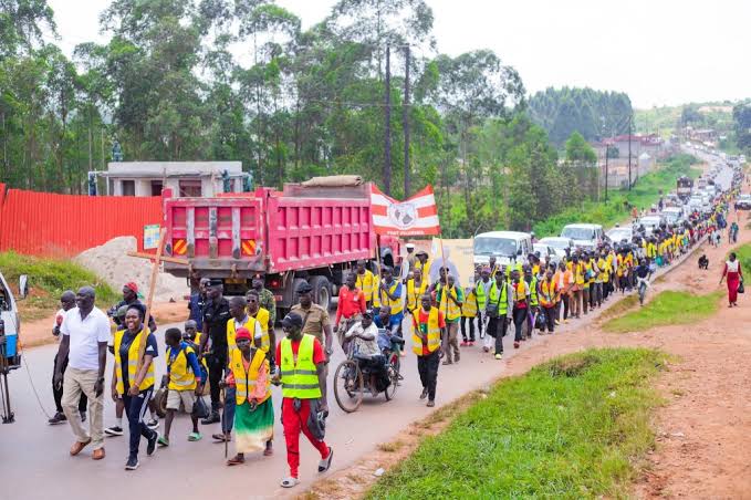 Walking pilgrims arriving at Uganda Martyrs Day 2027 pilgrimage accommodation Namugongo and the shrine