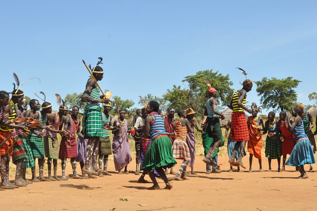 Uganda safari activities for kids under 15 – children at a cultural village in Uganda