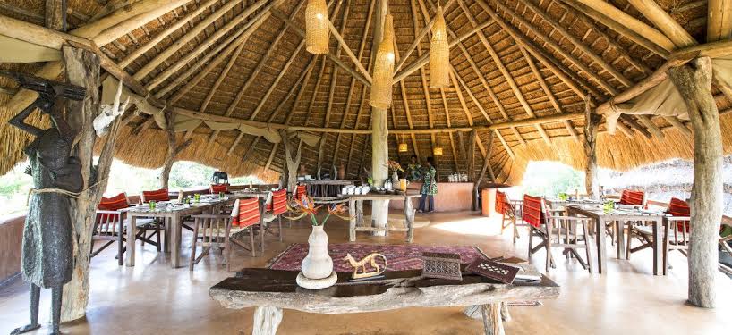 Uganda safari lodges with meeting rooms for corporate retreats – Mihingo Lodge conference tent overlooking waterhole