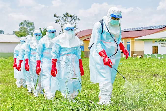 Uganda virus outbreak tourist park safety – armed rangers patrolling in Queen Elizabeth National Park