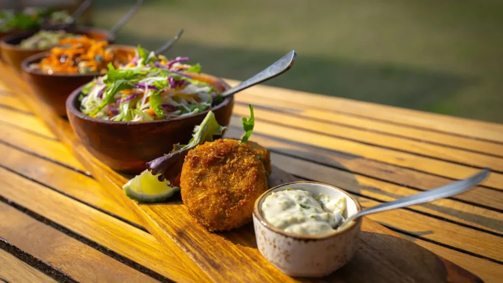 Vegan gluten free options Uganda safari lodges – chef preparing a special diet meal