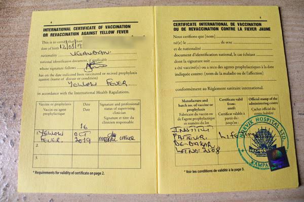 Yellow fever vaccine exemption waiver Uganda seniors – yellow card with exemption stamp