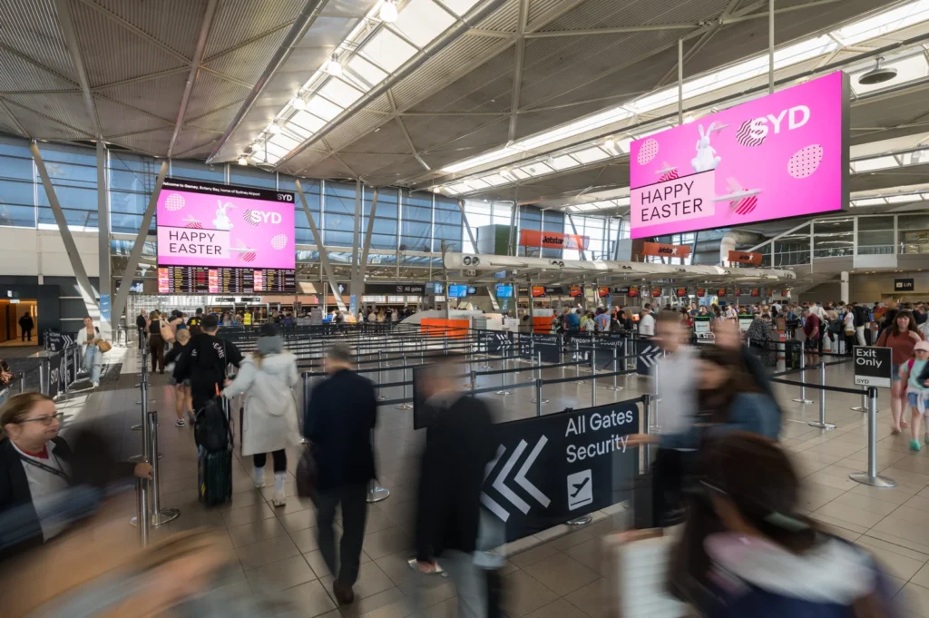 Travelers at Sydney airport before a Uganda safari from Australia