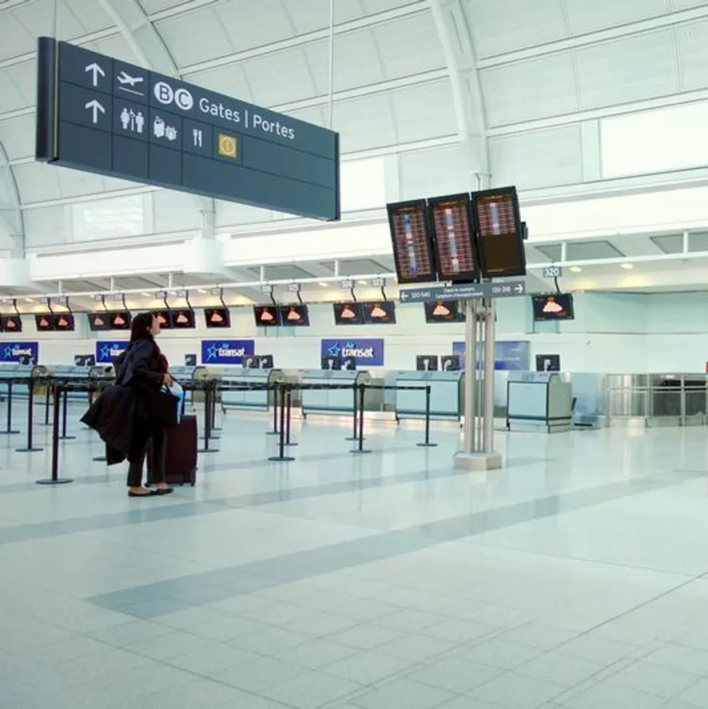 Travelers at Toronto Pearson airport before a Uganda safari from Canada