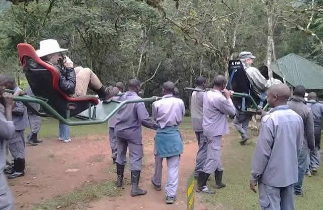 Sedan chair team assembled at the Bwindi trailhead before a trek