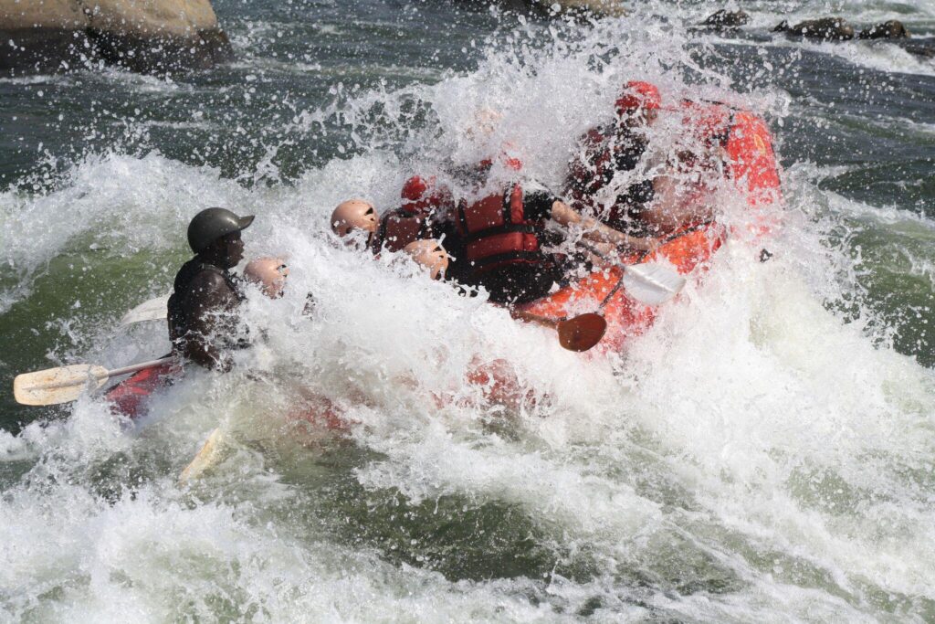 Rafters navigating a grade 5 rapid on the Nile near Jinja