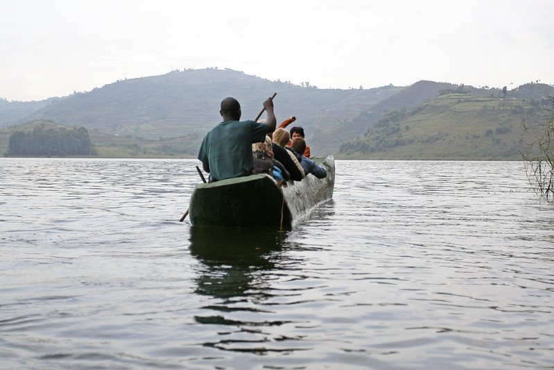 Boat approaching one of the islands on Lake Bunyonyi during an island-hopping tour
