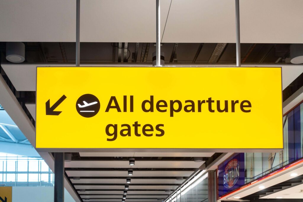 Travelers at London Heathrow before a Uganda gorilla safari from the UK