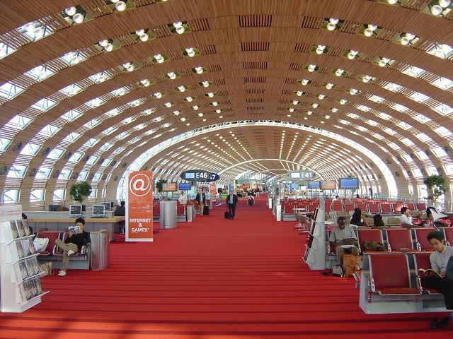 Travelers at Paris Charles de Gaulle airport before a Uganda safari from France