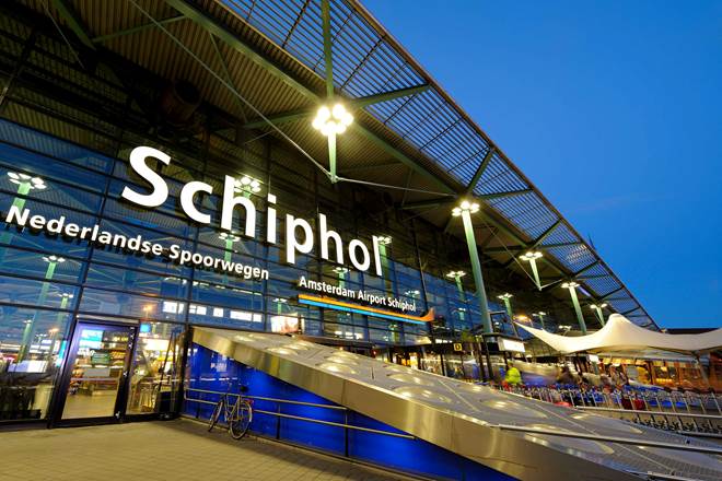 Travelers at Amsterdam Schiphol airport before a Uganda safari from the Netherlands