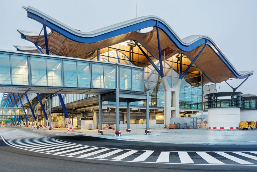 Travelers at Madrid Barajas Airport before a Uganda safari from Spain
