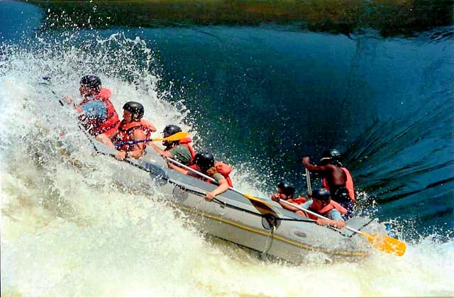 Rafters on a Grade 5 rapid on the Nile near Jinja